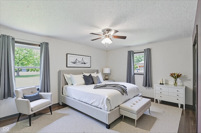 8510 N Carroll Rd, Indianapolis, IN 46236 - bedroom with wood finished floors, a textured ceiling, and ceiling fan