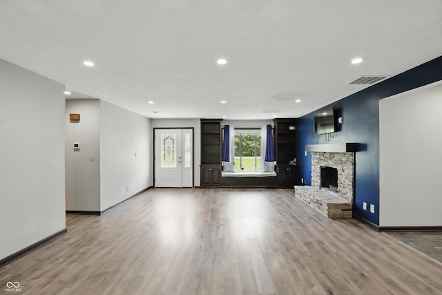 8510 N Carroll Rd, Indianapolis, IN 46236 - unfurnished living room with recessed lighting, wood finished floors, baseboards, and a stone fireplace