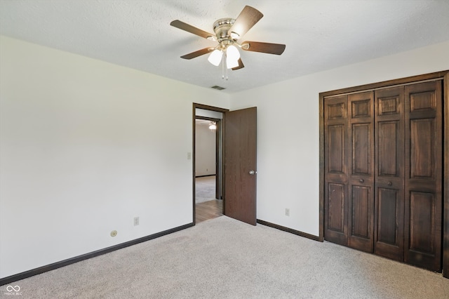 8510 N Carroll Rd, Indianapolis, IN 46236 - unfurnished bedroom featuring light carpet, baseboards, a closet, and a ceiling fan