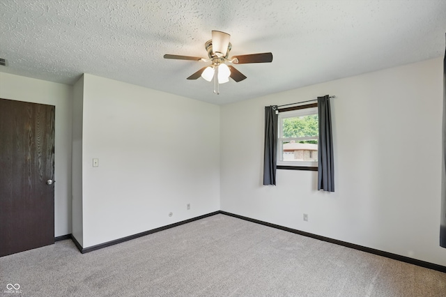 8510 N Carroll Rd, Indianapolis, IN 46236 - carpeted spare room with a ceiling fan, baseboards, and a textured ceiling