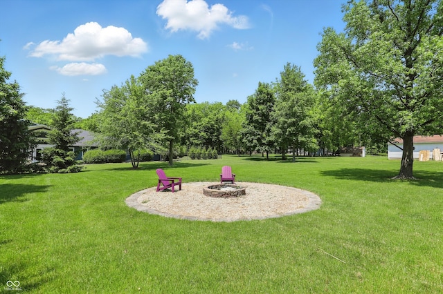 8510 N Carroll Rd, Indianapolis, IN 46236 - view of grassy yard with a fire pit