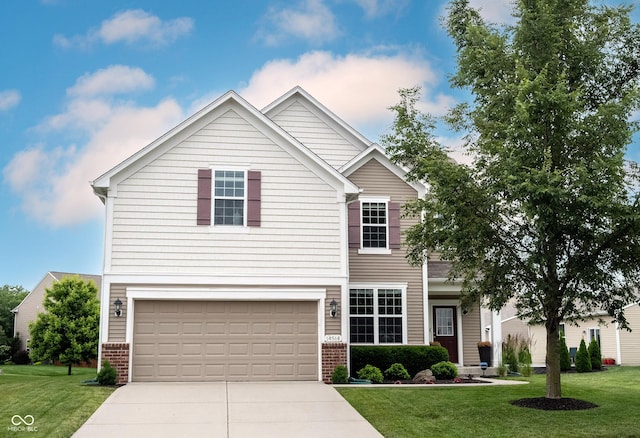 14514 Glapthorn Rd, Fishers, IN 46037 - traditional-style home with concrete driveway, a garage, a front yard, and brick siding