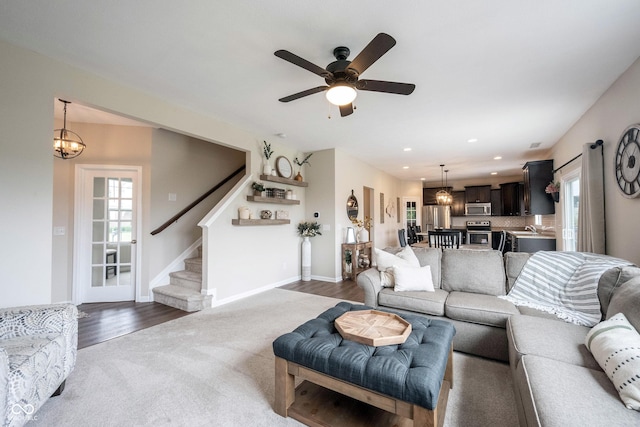 14514 Glapthorn Rd, Fishers, IN 46037 - living room with stairway, plenty of natural light, a chandelier, a ceiling fan, and recessed lighting