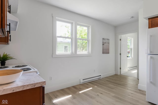 2602 State St, New Castle, IN 47362 - dining area featuring a baseboard radiator, light wood-style flooring, and baseboards