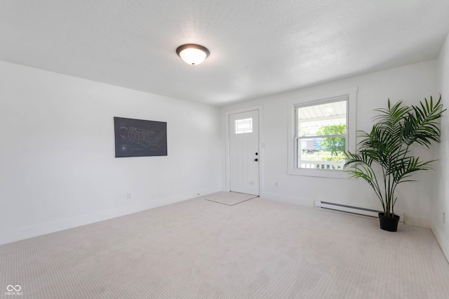 2602 State St, New Castle, IN 47362 - entrance foyer featuring baseboard heating, carpet, and baseboards