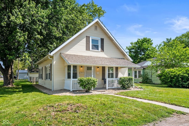 2602 State St, New Castle, IN 47362 - bungalow-style home featuring covered porch, a front yard, and roof with shingles