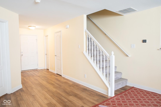 2388 Cedarmill Dr, Franklin, IN 46131 - stairs featuring hardwood / wood-style floors and baseboards