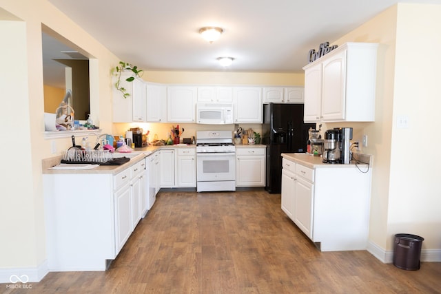 2388 Cedarmill Dr, Franklin, IN 46131 - kitchen featuring white appliances, dark wood finished floors, and light countertops