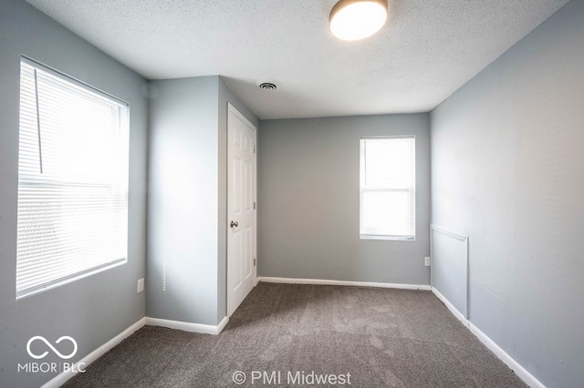5050 W Regent St, Indianapolis, IN 46241 - unfurnished bedroom featuring carpet floors, a textured ceiling, and baseboards