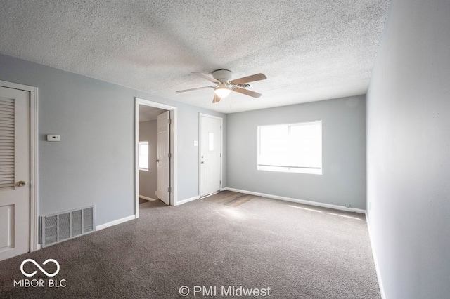 5050 W Regent St, Indianapolis, IN 46241 - unfurnished bedroom featuring carpet, baseboards, a textured ceiling, and a ceiling fan