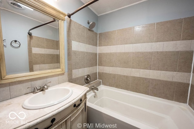 5050 W Regent St, Indianapolis, IN 46241 - bathroom featuring bathtub / shower combination, vanity, and decorative backsplash