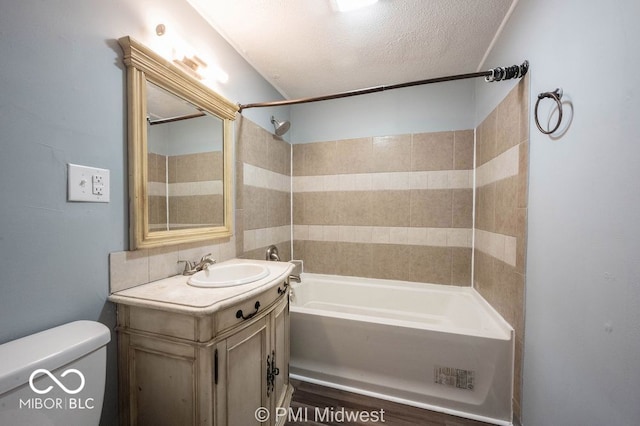 5050 W Regent St, Indianapolis, IN 46241 - full bathroom featuring toilet, vanity,  shower combination, and a textured ceiling