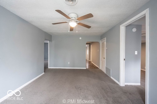 5050 W Regent St, Indianapolis, IN 46241 - carpeted spare room featuring arched walkways, ceiling fan, a textured ceiling, and baseboards