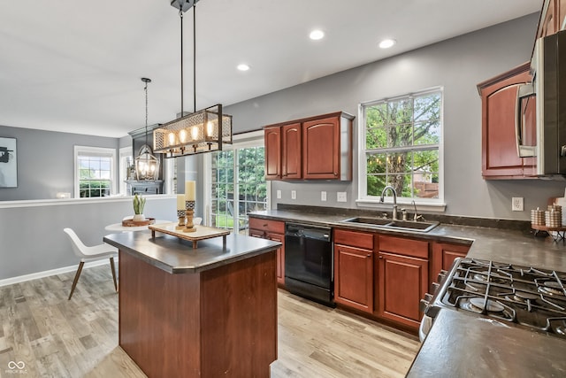 8663 N Commonview Dr, Mccordsville, IN 46055 - kitchen featuring black dishwasher, a sink, dark countertops, range with gas cooktop, and a kitchen island