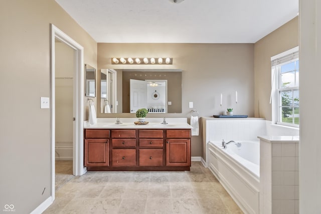 8663 N Commonview Dr, Mccordsville, IN 46055 - full bath featuring double vanity, a garden tub, and baseboards