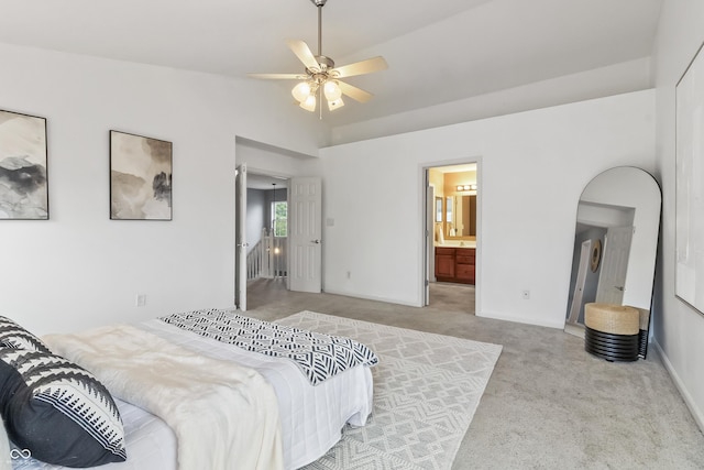 8663 N Commonview Dr, Mccordsville, IN 46055 - bedroom with carpet, ensuite bath, lofted ceiling, baseboards, and ceiling fan