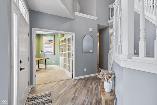 8663 N Commonview Dr, Mccordsville, IN 46055 - foyer entrance with wood finished floors, baseboards, and a high ceiling
