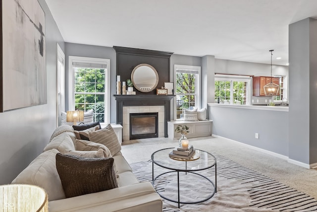 8663 N Commonview Dr, Mccordsville, IN 46055 - carpeted living room featuring baseboards and a tile fireplace