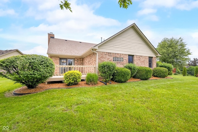 1105 Sarah Ct, Greenwood, IN 46142 - rear view of house featuring brick siding, a deck, a chimney, a yard, and a shingled roof