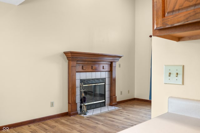1105 Sarah Ct, Greenwood, IN 46142 - detailed view of wood finished floors, baseboards, and a fireplace