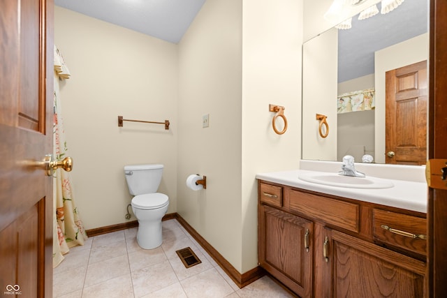 1105 Sarah Ct, Greenwood, IN 46142 - full bath featuring vanity, toilet, baseboards, and tile patterned floors