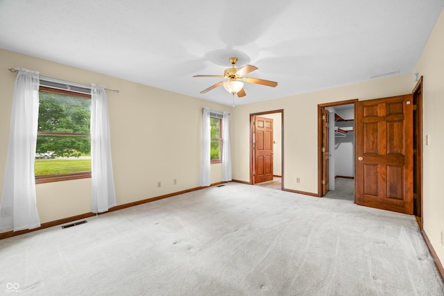 1105 Sarah Ct, Greenwood, IN 46142 - unfurnished bedroom featuring multiple windows, carpet flooring, baseboards, and a spacious closet