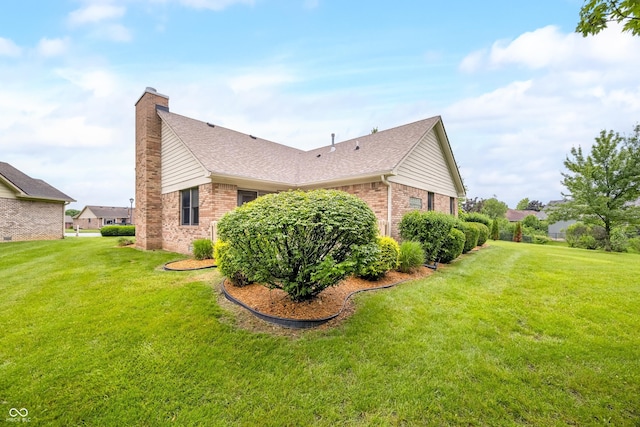 1105 Sarah Ct, Greenwood, IN 46142 - view of side of property featuring brick siding, a chimney, and a yard
