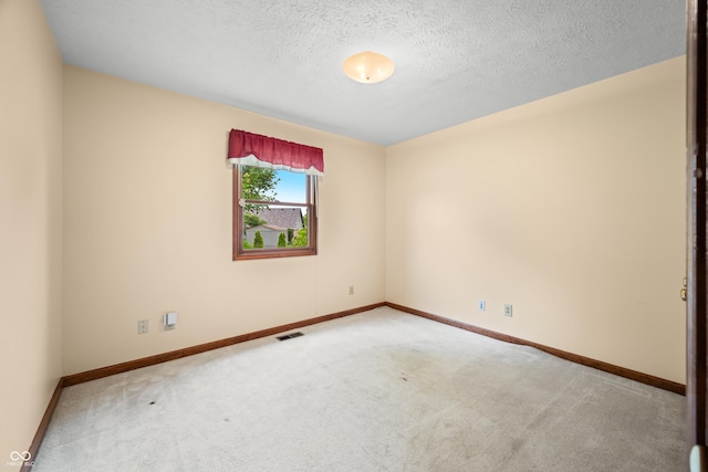 1105 Sarah Ct, Greenwood, IN 46142 - empty room with carpet, baseboards, and a textured ceiling
