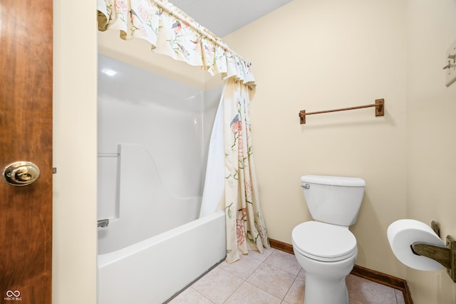 1105 Sarah Ct, Greenwood, IN 46142 - full bath with tile patterned floors, toilet, shower / bath combo with shower curtain, and baseboards