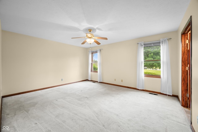 1105 Sarah Ct, Greenwood, IN 46142 - unfurnished room with ceiling fan, light carpet, and baseboards