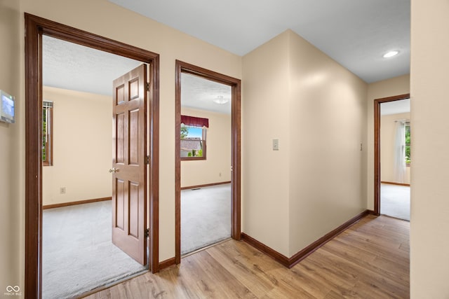 1105 Sarah Ct, Greenwood, IN 46142 - corridor with light wood-style floors, baseboards, and recessed lighting
