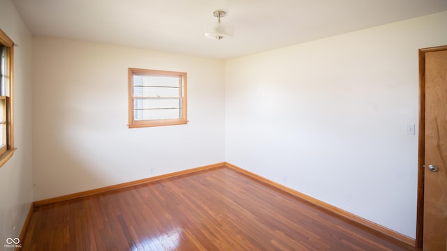 1460 W Mckay Rd, Shelbyville, IN 46176 - unfurnished room featuring wood finished floors and baseboards