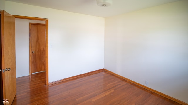 1460 W Mckay Rd, Shelbyville, IN 46176 - empty room with wood finished floors and baseboards