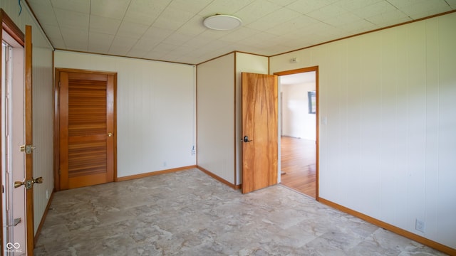 1460 W Mckay Rd, Shelbyville, IN 46176 - unfurnished bedroom with wooden walls and baseboards