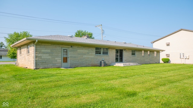 1460 W Mckay Rd, Shelbyville, IN 46176 - back of property with a lawn, stone siding, and central AC