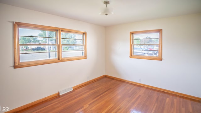 1460 W Mckay Rd, Shelbyville, IN 46176 - empty room featuring baseboards and light wood finished floors