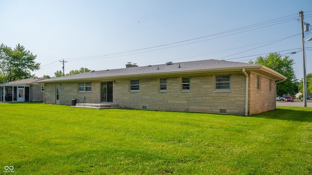 1460 W Mckay Rd, Shelbyville, IN 46176 - rear view of property featuring stone siding, a lawn, a chimney, and crawl space