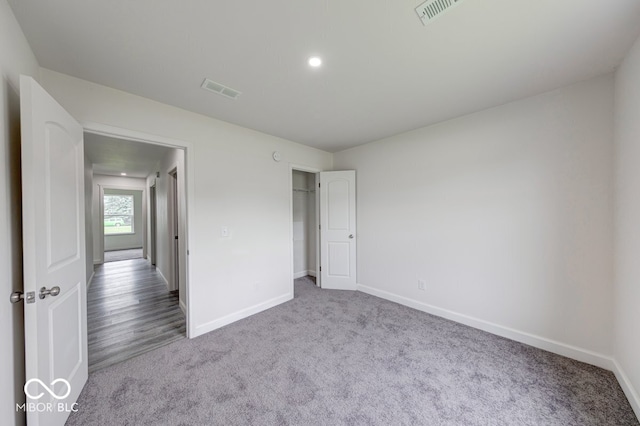 32 Downing Dr, Trafalgar, IN 46181 - unfurnished bedroom with carpet flooring, baseboards, and recessed lighting