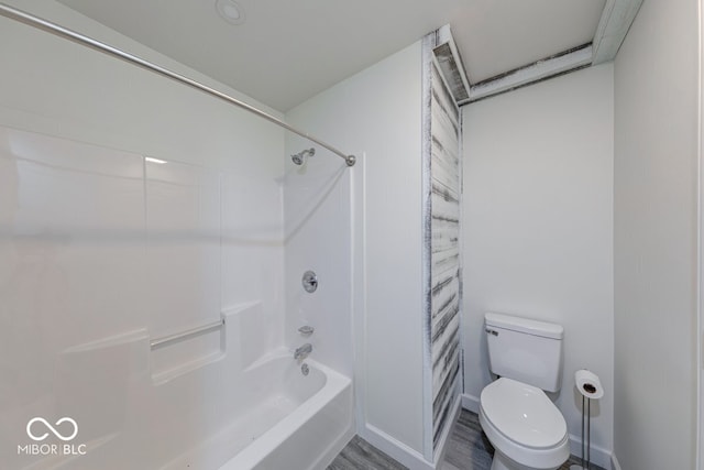 32 Downing Dr, Trafalgar, IN 46181 - bathroom featuring toilet, shower / tub combination, and wood finished floors