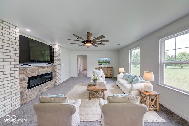 32 Downing Dr, Trafalgar, IN 46181 - living room with a large fireplace, carpet, baseboards, and a ceiling fan