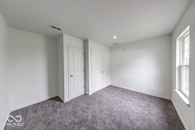 32 Downing Dr, Trafalgar, IN 46181 - unfurnished bedroom featuring carpet, multiple windows, baseboards, and recessed lighting
