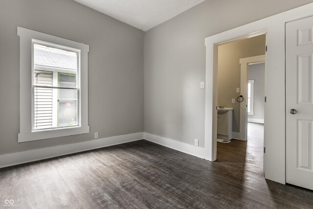 3652 N Kenwood Ave, Indianapolis, IN 46208 - spare room featuring dark wood finished floors and baseboards