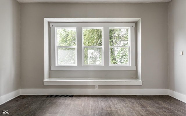 3652 N Kenwood Ave, Indianapolis, IN 46208 - spare room featuring baseboards and dark wood-style floors