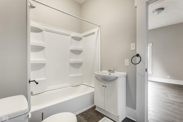 3652 N Kenwood Ave, Indianapolis, IN 46208 - full bathroom featuring toilet, vanity, shower / bathtub combination, baseboards, and wood finished floors