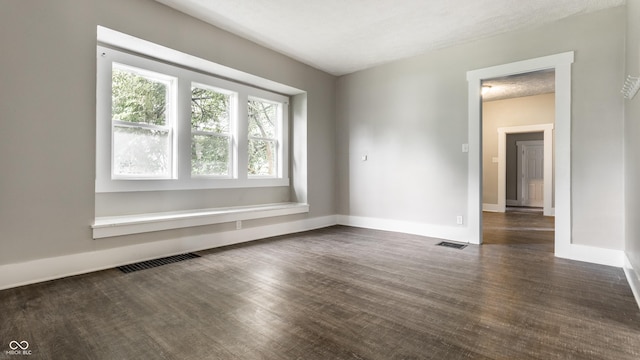 3652 N Kenwood Ave, Indianapolis, IN 46208 - unfurnished room featuring dark wood-type flooring and baseboards