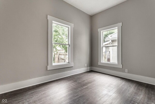 3652 N Kenwood Ave, Indianapolis, IN 46208 - unfurnished room with dark wood-type flooring and baseboards