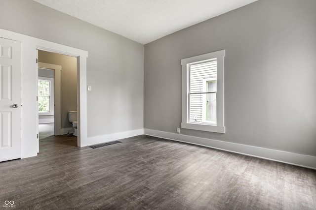 3652 N Kenwood Ave, Indianapolis, IN 46208 - unfurnished room featuring baseboards and dark wood-type flooring