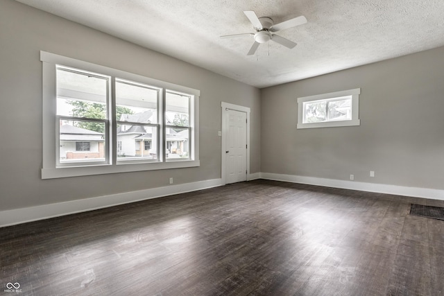 3652 N Kenwood Ave, Indianapolis, IN 46208 - unfurnished room with dark wood-style floors, ceiling fan, baseboards, and a textured ceiling