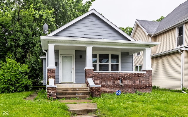 3652 N Kenwood Ave, Indianapolis, IN 46208 - view of front of house featuring a porch and a front lawn