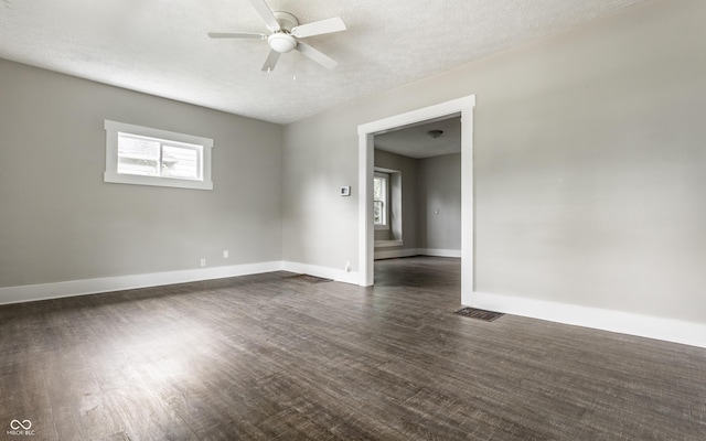 3652 N Kenwood Ave, Indianapolis, IN 46208 - unfurnished room with ceiling fan, a textured ceiling, baseboards, and dark wood finished floors